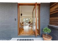 Inviting front entrance featuring hardwood floors and modern design elements at 4351 Peachtree Dunwoody Ne Rd, Atlanta, GA 30342
