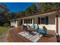 Inviting front porch with modern outdoor seating, a perfect space for relaxing and entertaining at 2750 Old Horseshoe Bend Sw Rd, Marietta, GA 30064