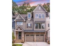 Charming townhome with a two-car garage and craftsman-style details at 224 Trecastle Sq # 22, Canton, GA 30114