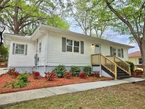 Charming single-story home featuring a landscaped front yard and welcoming entryway at 2495 Se Glendale Se Cir, Smyrna, GA 30080