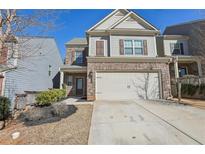 Charming home with a two-car garage, brick accents, and well-maintained landscaping at 1969 Charcoal Ives Rd, Lawrenceville, GA 30045