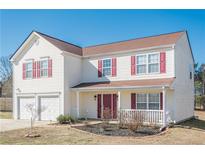 Charming two-story home with a two-car garage and well-maintained front yard at 351 Grandview Cir, Powder Springs, GA 30127