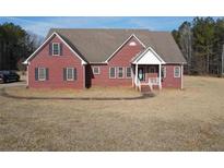 Charming single-Gathering home with a classic brick facade and well-manicured front yard at 172 Lakeview Dr, Newborn, GA 30056