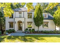 Charming two-story home with a brick facade, manicured lawn, and inviting front entrance at 515 Danube Rd, Atlanta, GA 30342
