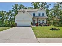 Charming two-story home featuring white siding, a two-car garage, and a well-manicured front lawn at 97 Brookstone Ct, Acworth, GA 30101