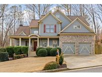 Charming two-story home with stone accents, inviting front porch and well manicured yard at 170 Maple View Ct, Dallas, GA 30157