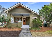 Charming craftsman home with a welcoming front porch, beautiful landscaping, and a stone pathway to the front door at 816 3Rd Ave, Decatur, GA 30030