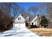 Charming two-story home with attached two-car garage and a well-manicured front yard at 3330 Valley Vista Se Rd, Smyrna, GA 30080