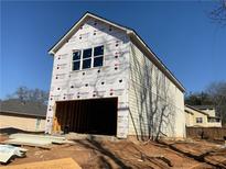 New two-story home under construction with siding, garage, and bright windows at 4862 Campbell Dr, Atlanta, GA 30349