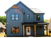 Charming two-story home featuring a covered front porch and modern curb appeal with a blue exterior at 131 Old Alabama Se Rd, Emerson, GA 30137