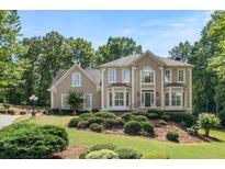 Charming two-story home with beautiful landscaping and mature trees, offering great curb appeal at 4002 Turnstone Nw Dr, Kennesaw, GA 30152