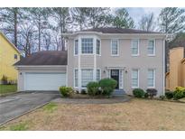 Charming two-story home with neutral color and a two-car garage at 3174 Palm Tree Dr, Lithonia, GA 30038