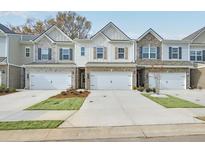 Charming townhomes with stone and siding exteriors, complemented by well-maintained lawns and driveways at 3848 Pressley Ln # 26, Powder Springs, GA 30127