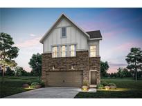 Stunning two-story home featuring stone and siding, a two-car garage, and professionally landscaped front yard at 5760 Tillman Way, Powder Springs, GA 30127