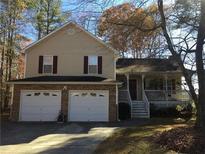 Charming two-story home features an attached two-car garage and covered porch, perfect for enjoying the outdoors at 443 Hannah Dr, Temple, GA 30179