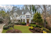 Charming two-story home featuring a landscaped front yard and inviting entrance with elegant architectural design at 2616 Boddie Pl, Duluth, GA 30097