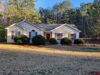 Charming one-story home featuring a well-maintained yard and inviting curb appeal with classic design and mature landscaping at 104 Worthy Dr, Mcdonough, GA 30252