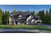Two-story home with gray brick, black trim, a manicured lawn and an attached two-car garage at 2808 Carson Garret Ct, Buford, GA 30519