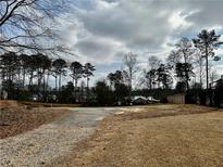 Expansive vacant lot offers potential for new construction in established community at 120 Woodlawn Dr, Marietta, GA 30067