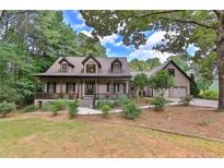 Charming home with a welcoming front porch and well-maintained landscaped yard at 1230 Mars Hill Nw Rd, Acworth, GA 30101