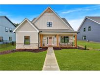 Charming craftsman-style home with a well-manicured lawn and inviting front porch at 133 Old Alabama Se Rd, Emerson, GA 30137