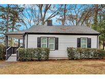 Charming single-story home featuring a cozy front porch and freshly painted exterior at 1222 E Forrest Ave, Atlanta, GA 30344