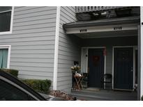 Two-story home featuring side-by-side front doors and neutral siding for a cozy neighborhood living at 1026 Riverbend Club Se Dr, Atlanta, GA 30339