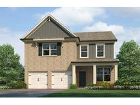 Charming two-story home with brick and gray siding and a well-manicured front lawn at 113 Maplewood Ln, Conyers, GA 30094