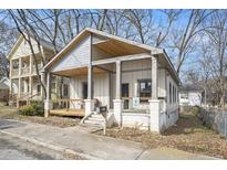 Inviting craftsman-style home with a charming front porch and classic architectural details at 953 Michigan Ave, Atlanta, GA 30314