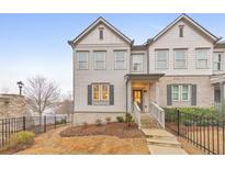 Charming two-story townhouse with a well-maintained front yard and classic architectural details at 259 Vista Ln, Woodstock, GA 30189