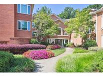 Beautiful building exterior with colorful flower beds and a walkway leading to the entrance at 5306 Brooke Ridge Dr, Atlanta, GA 30338