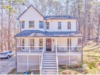 Charming two-story home featuring a welcoming front porch and well-maintained landscaping at 2738 Allyn Nw Way, Kennesaw, GA 30152