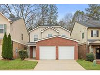 Charming two-story home featuring a brick facade and attached two-car garage at 236 Rankin Cir, Mcdonough, GA 30253