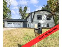Renovated two-story home with a spacious garage and traditional architecture at 4239 Newcomb Rd, Decatur, GA 30034