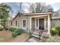 Charming single-story home with neutral siding, landscaped yard, and inviting front porch at 2312 Wayside Ne Dr, Brookhaven, GA 30319