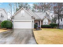 Charming single-Gathering home featuring a two-car garage and well-manicured front yard at 2160 Berryhill Se Cir, Smyrna, GA 30082