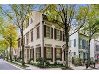Charming two-story home featuring symmetrical design, window boxes and manicured landscaping at 301 Abercorn Sq, Peachtree City, GA 30269