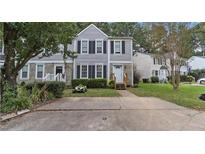 Charming two-story home with a well-manicured front yard and stone accents at 3473 Lee Ct, Kennesaw, GA 30144
