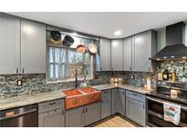 Updated kitchen featuring stainless steel appliances, custom cabinets, and copper farmhouse sink at 270 Cochran Ridge Rd, Dallas, GA 30157