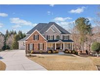Beautiful two-story home featuring stone and siding, with a well-manicured lawn and inviting driveway at 600 Blackwater Rdg, Canton, GA 30114