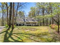 Charming single-Gathering home featuring a well-maintained lawn and inviting front porch at 113 Bridget Dr, Hampton, GA 30228