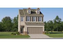 Charming two-story home featuring a two-car garage, dormer windows, and manicured lawn at 2458 Cotton Ln, Douglasville, GA 30135