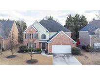 Charming two-story brick home with attached two-car garage, mature landscaping, and a well-maintained yard at 480 Glenns Farm Way Way, Grayson, GA 30017