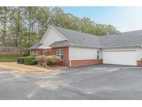 Charming single-story home with a two car garage, manicured landscaping, and brick accents at 4479 Caleb Xing, Powder Springs, GA 30127