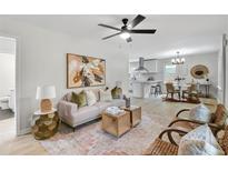 Inviting living room featuring light wood floors, neutral walls, and stylish modern furnishings at 3393 Phillip Cir, Decatur, GA 30032