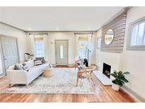Bright living room with hardwood floors, fireplace, and neutral decor, perfect for relaxing or entertaining at 49 Wyman Se St, Atlanta, GA 30317