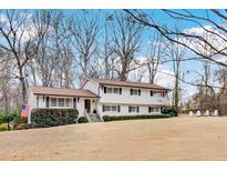 Charming two-story home featuring a manicured lawn and classic black shutters for a timeless appeal at 3519 Sunderland Ne Way, Brookhaven, GA 30319