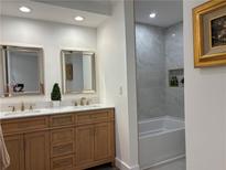 Elegant bathroom features a double vanity with gold fixtures and a separate shower/tub at 3093 Colonial Way # B, Atlanta, GA 30341