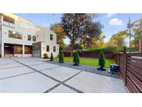 Modern two-story home featuring a large driveway and landscaped front yard at 1099 Vista Ne Trl, Atlanta, GA 30324