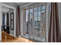 This condo features a balcony with city views and sliding glass doors for easy access at 199 14Th Ne St # 2010, Atlanta, GA 30309